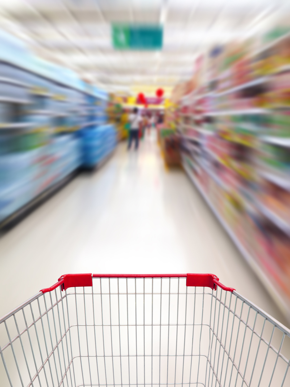 Shopping in supermarket by supermarket shopping cart